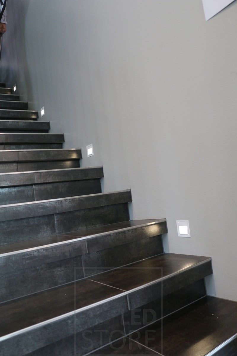 Recessed wall lights, which at the third step is enough to illuminate the stairs.